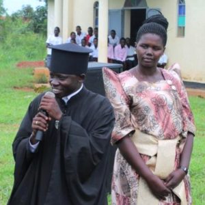 Fr. Simon and his presbytera at their parish in Uganda